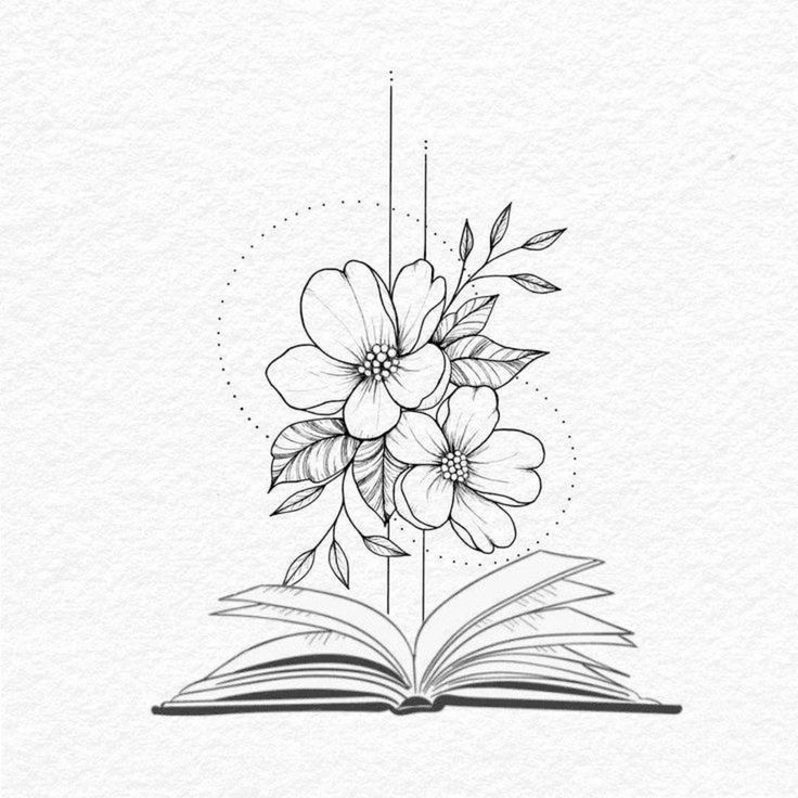 an open book with flowers on it