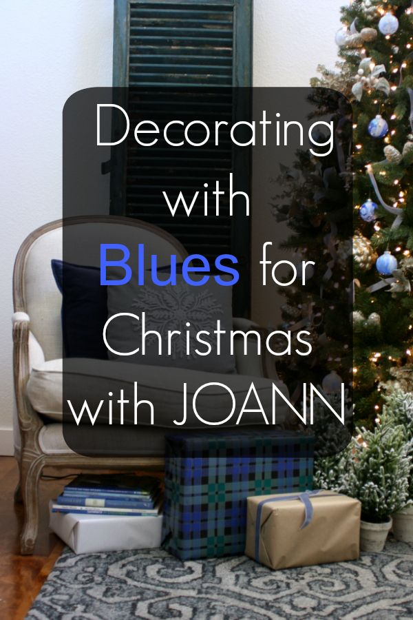 a christmas tree with presents under it and the words decorating with blues for christmas with joann