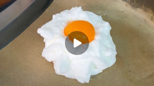 an egg frying in a skillet on top of a stove