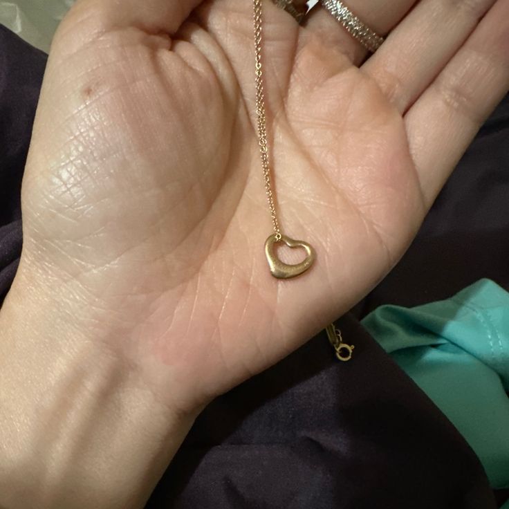 Authentic Rose Gold Open Heart Necklace. Price Is Firm. Authentic, Used Condition Of Course. Clasp Is Stamped Peretti And Tiffany And Co 750. May Need Some Cleaning/Polishing Since It’s Been Stored Away Serious Inquiries Only And No Low Offers. No Returns/Sold As Is. Please Don’t Waste My Time And Only Message Me If You Are Really Interested Purchasing This. I Recently Got Robbed/Attacked So I Need To Sell My Personal Items To Help Cover My Losses/Medical Expenses. Please Do Ask Questions Before Purchasing.Thank You. Tiffany And Co Gold Heart Necklace, Elegant Gold Heart Necklace For Formal Events, Elegant Heart Cut Necklace For Party, Elegant Gold Heart Necklace For Party, Elegant Heart Pendant Necklace For Formal Occasions, Formal Heart Cut Necklace, Luxury Heart Pendant Necklace For Party, Luxury Open Heart Necklace For Formal Occasions, Elegant Open Heart Jewelry For Party