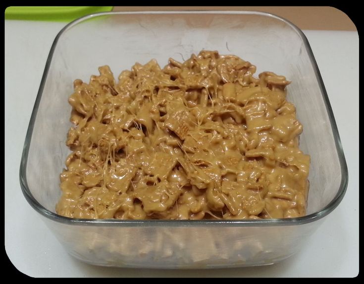 a glass bowl filled with food on top of a table