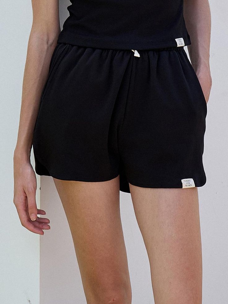 This is a modern and casual short pants by FACADE PATTERN that is made out of high quality and sturdy fabric. With unique design detail and trendy mood, you can style it for your clean and casual daily outfit.- Elastic waistband with adjustable string- Relaxed silhouette- Two pockets on the front Black Drawstring Bottoms For Everyday, Modern Black Shorts For Workwear, Short Length Bottoms With Drawstring And Adjustable Waist, Modern Black Workwear Shorts, Black Bottoms With Functional Drawstring For Summer, Black Summer Bottoms With Functional Drawstring, Black Cotton Bottoms With Drawstring, Leisure Bottoms With Functional Drawstring, Loungewear Bottoms With Functional Drawstring In Short Length