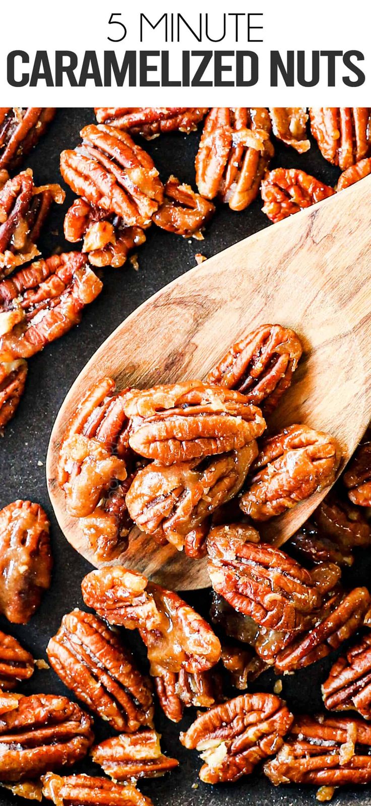 a wooden spoon filled with caramelized nuts on top of a black surface next to a pile of chopped pecans