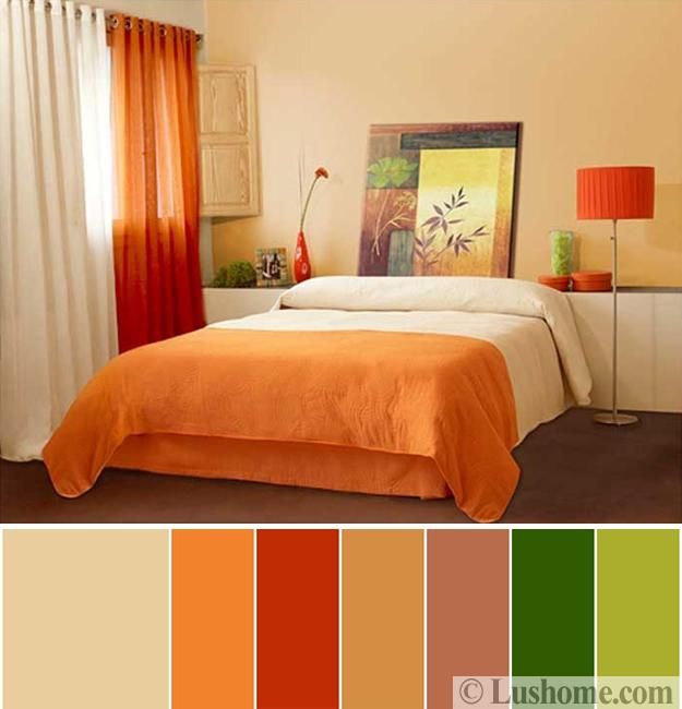 a bedroom with orange and green colors on the walls, curtains, bedding, and lamps