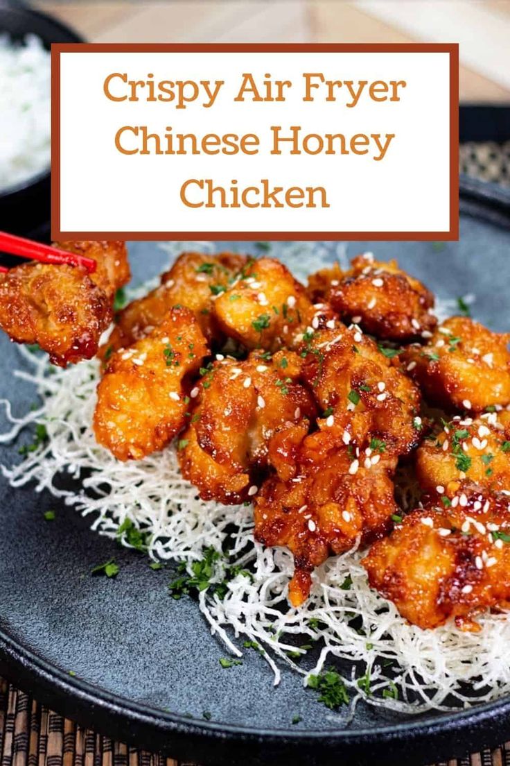 crispy air fryer chinese honey chicken on a bed of white rice with chopsticks