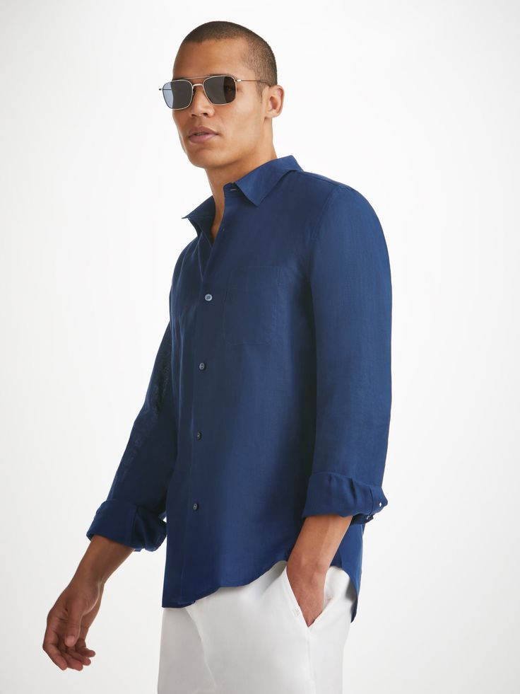 The Monaco shirt features a curved back yoke with a box-pleat for comfort and a curved hem with side vents for ease of movement. We've used the classic styling of a button-through front and cuffs, a 2-piece collar and for a modern addition, we've added a U-shaped breast pocket with a handy sunglass loop for effortless summer chic. For a final touch of luxe, the shirt is finished with mother of pearl buttons throughout and our minimalist rose logo label at the hem. There's also a handy 'locker' l Casual Semi-formal Shirt With Button Cuffs, Casual Shirt With Button Cuffs For Semi-formal Occasions, Long Sleeve Shirt With Concealed Placket For Summer, Summer Long Sleeve Shirt With Concealed Placket, Classic Linen Tops With Fold Down Collar, Semi-formal Casual Shirt With Fold Down Collar, Semi-formal Collared Linen Top, Timeless Summer Tops With Spread Collar, Collared Linen Top For Semi-formal Occasions