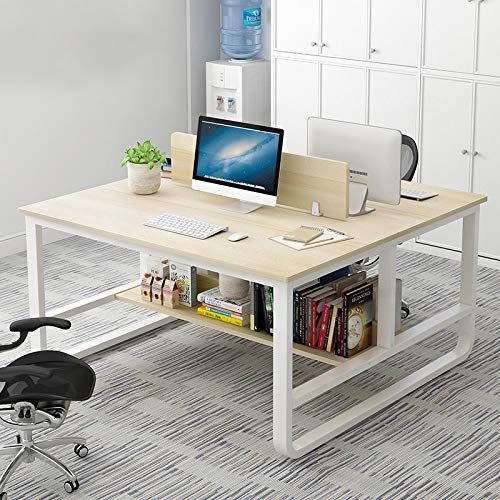 an office desk with a computer and bookshelf next to it on the floor