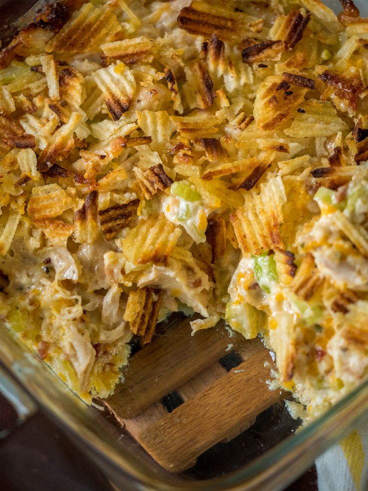 a casserole dish with chicken and cheese in it