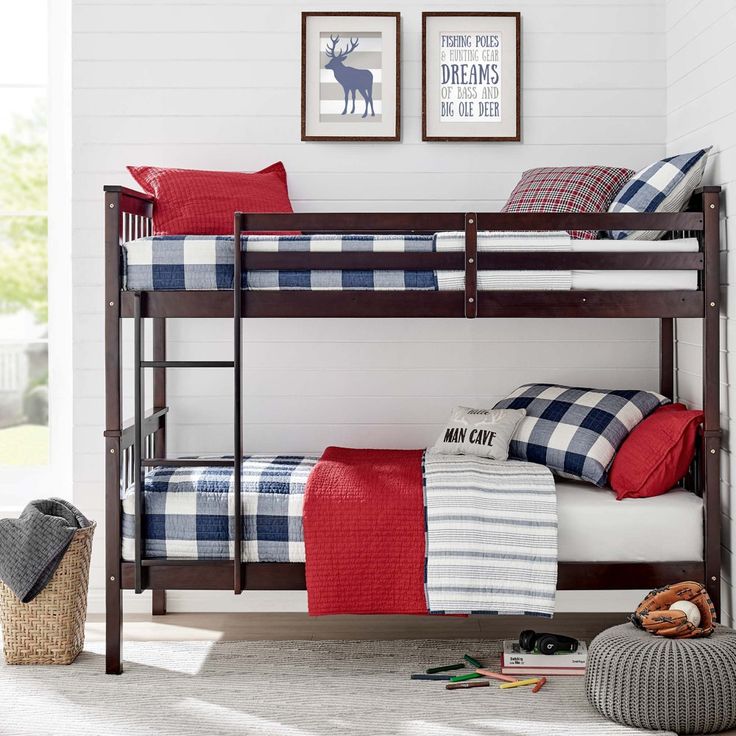 a bunk bed with plaid sheets and pillows in a child's playroom or bedroom