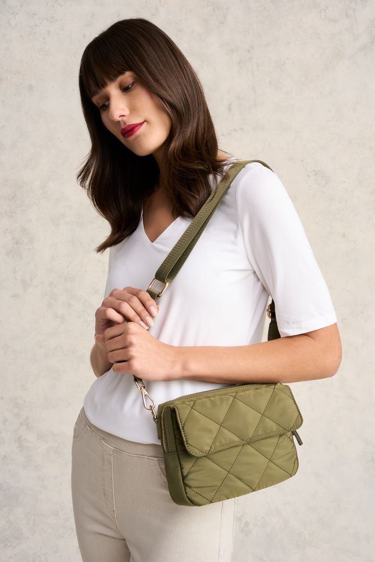 Great for travel or as an everyday accomplice, our Medina Soft Crossbody Bag in Khaki features elegant, quilted detailing at the front and a comfortable guitar strap. Storage includes a main zip compartment and outer slip pocket. Your next adventure awaits! Quilted Crossbody Bag For On-the-go, Versatile Quilted Shoulder Bag For Everyday, Versatile Everyday Quilted Shoulder Bag, Functional Quilted Shoulder Bag For On-the-go, Versatile Quilted Everyday Bag, Quilted Crossbody Satchel For Travel, Quilted Crossbody Shoulder Bag For Everyday Use, Everyday Quilted Satchel Shoulder Bag, Versatile Quilted Bag For Everyday Use