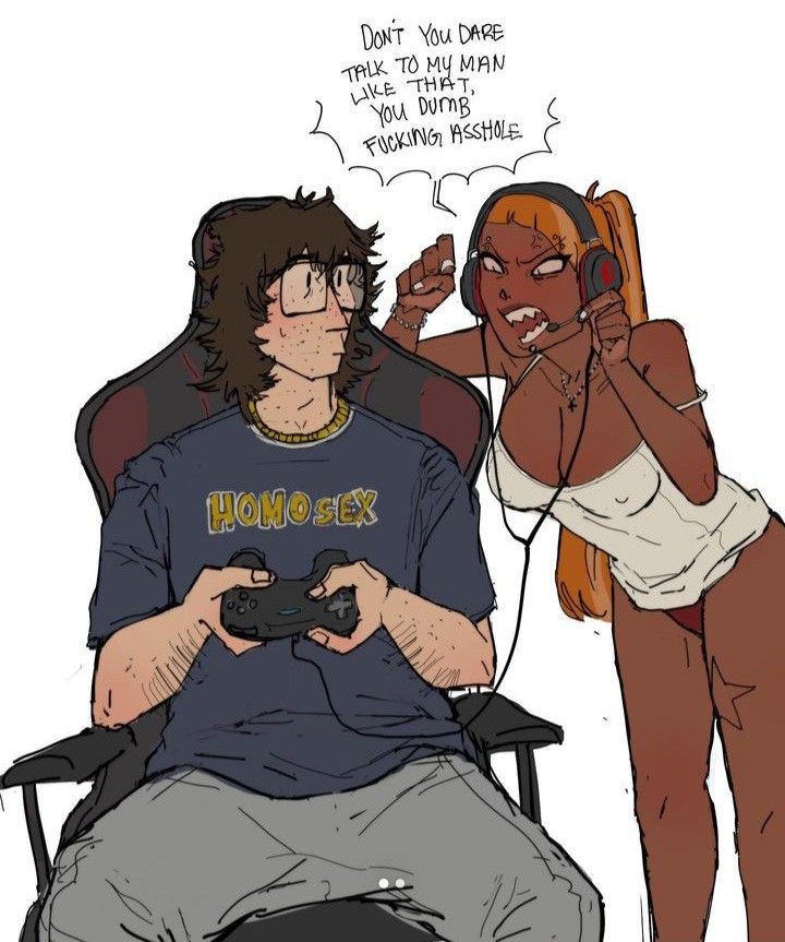 two people sitting next to each other while one person holds a video game controller in his hand