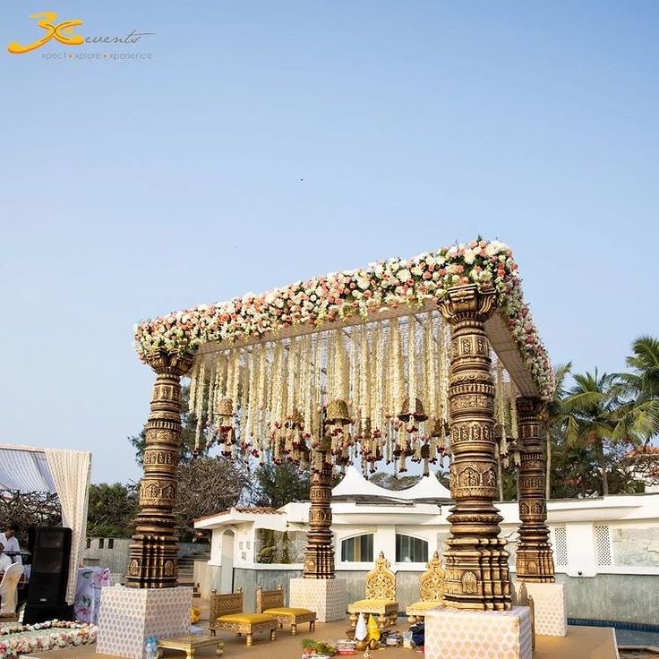 an outdoor wedding setup with flowers and decorations