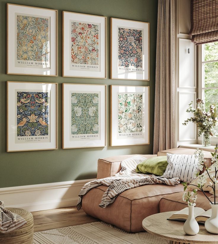 a living room filled with furniture and pictures on the wall above it's coffee table