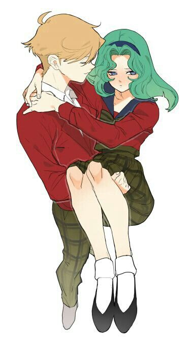 two people hugging each other with their arms around one another, while they are wearing red shirts and green hair