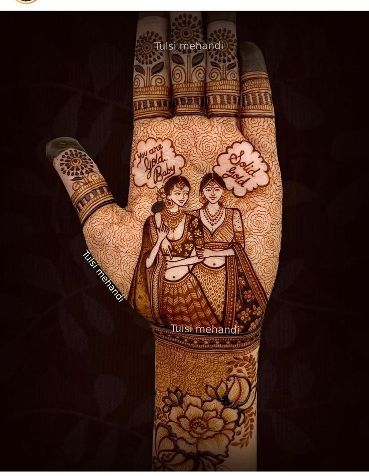 a hand painted with two women on it and flowers in the background, says tulsmehandi