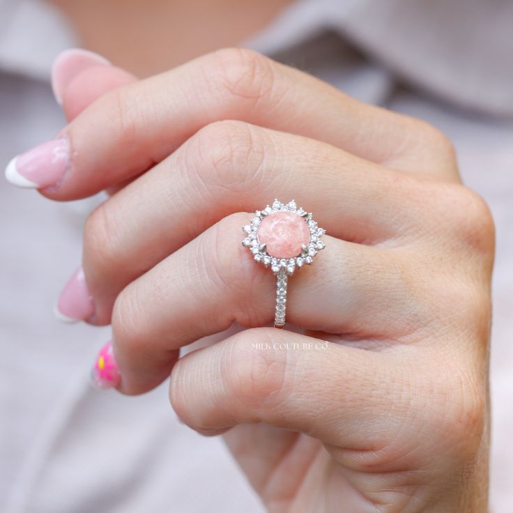 The Stella ring is a work of art, intricately designed to resemble a star in the night sky. The round center keepsake stone is the centerpiece of the design, and it sits nestled in the center of the ring, surrounded by a halo of smaller stones that accentuate its beauty. Estelle means star in Italian, and this ring is named in honor of my late grandma Estelle. She was a woman who truly shined like a star, with the most unforgettable smile and laugh! Luxury Gemstones With Halo Setting For Wedding, Luxury Halo Setting Gemstones For Wedding, Exquisite Round Brilliant Cut Gemstones, Fine Jewelry Diamond Gemstone With Center Stone, Diamond Solitaire Fine Jewelry, Exquisite Round Gemstones With Halo Setting, Exquisite Round Diamond Gemstones, Luxury Cluster Ring With Round Cut Gemstone, Diamond Gemstone With Center Stone In Round Cut