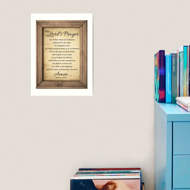 a wooden frame with a poem on it next to a blue dresser and bookshelf