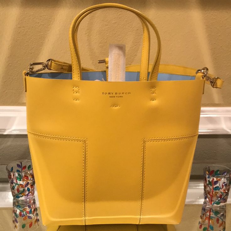 Nwot Yellow Tory Burch Tote. This Is A 10x11 Tote Bag With A Small Removable Wallet. It Comes With Removable Straps To Use As A Crossbody Bag. No Damages Or Stains On It. The Original Tory Burch Dust Bag Is Included. Luxury Yellow Tote Bag, Luxury Yellow Shopping Bag, Yellow Tote Shoulder Bag With Dust Bag, Yellow Crossbody Bag For Errands, Designer Yellow Bags For Everyday Use, Luxury Yellow Bag With Top Carry Handle, Yellow Shoulder Bag With Gold-tone Hardware For Daily Use, Designer Yellow Bag With Top Carry Handle, Yellow Bucket Bag For Errands