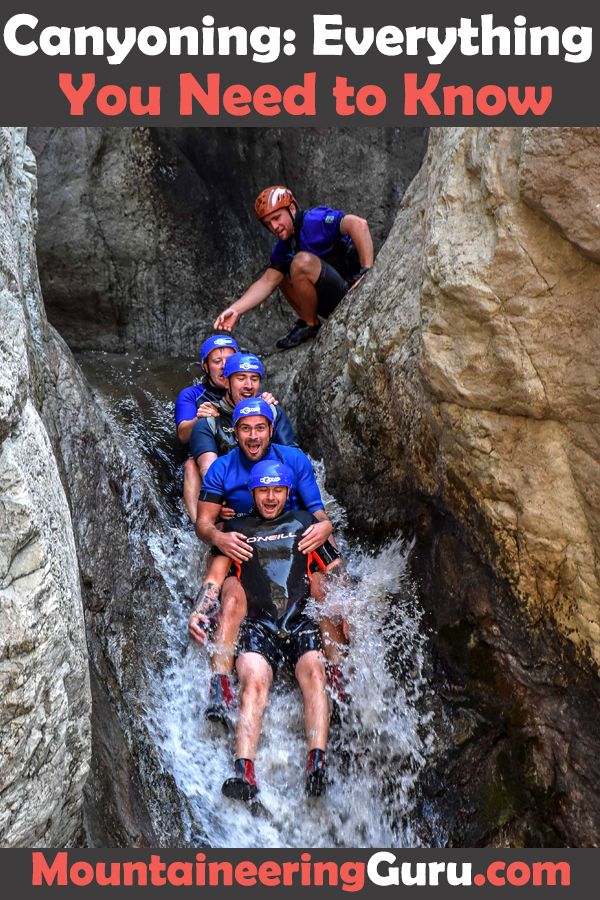 a group of people climbing up a mountain with text overlay that reads canyoning everything you need to know