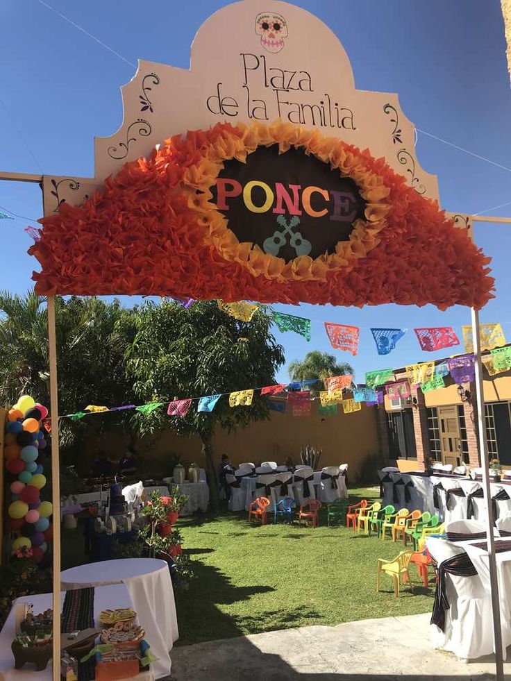 an outdoor event with tables and chairs under a sign that says ponc on it