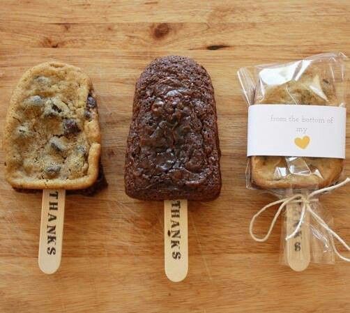 three pieces of bread sitting on top of a wooden table