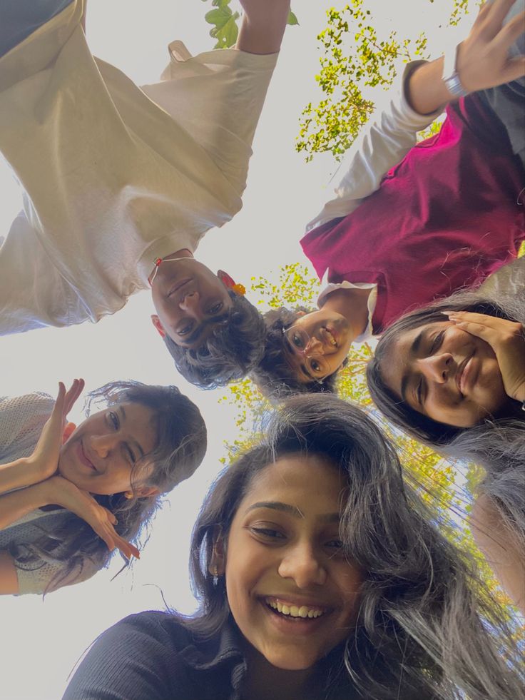 a group of young women standing in a circle