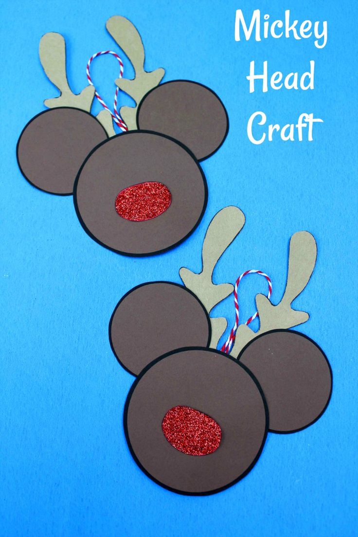 mickey mouse head craft with red glitter on the nose and antlers attached to it