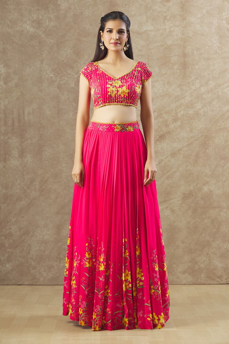 Reddish pink chinon silk lehenga with an attached cancan, floral print and sequins and beaded hand embroidered waistband. Comes with a padded blouse.
Components: 2
Pattern: Printed, Hand embroidered
Type Of Work: Floral, Sequins, Beads
Neckline: V Neck
Sleeve Type: Short
Fabric: Georgette
Color: Red, Pink
Other Details: 
Attached lining
Lehenga length : 45 inches
Approx Product Weight : 2 Kgs
Closure :
Lehenga : Side zip
Blouse : Back hooks and Drawstrings
Occasion: Sangeet - Aza Fashions Traditional Pink Skirt Set With Dupatta, Diwali Anarkali Pink Skirt Set, Pink Anarkali Skirt Set For Diwali, Pink Anarkali Skirt Set For Festive Occasions, Pink Saree Skirt Set For Diwali, Traditional Drape Pink Skirt Set For Diwali, Bollywood Pink Skirt Set With Zari Work, Pink Bollywood Skirt Set With Zari Work, Pink Skirt Set With Dupatta For Festive Occasions