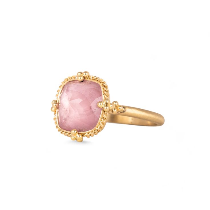 Bringing to mind the first signs of Spring, this Morganite is a lovely shade of petal pink. This ring is complete with a handmade bezel that encases this gem with a yellow gold radiance. One of a kind.Ready to ship in size 7. Please allow 1-2 weeks for any other size. Technical Details Metal: 18k yellow goldMorganite: 4.17 cts. Ring face: 13.5mm x 13.5mmBand width: 2mmHandmade in New YorkStyle # R-2721-MOR Luxury Pink Sapphire Rings With Gemstone, Exquisite 14k Gold Pink Jewelry, Elegant Pink Sapphire Ring With Rose Cut Diamonds, Pink Tourmaline Rings With Gemstone Accents, Exquisite Pink 14k Gold Jewelry, Yellow Gold Rings With Pink Sapphire And Gemstone Accents, Luxury Pink Sapphire Ring As A Gift, Elegant Pink Ruby Gemstone Ring, Elegant Pink Topaz Ring In 14k Gold