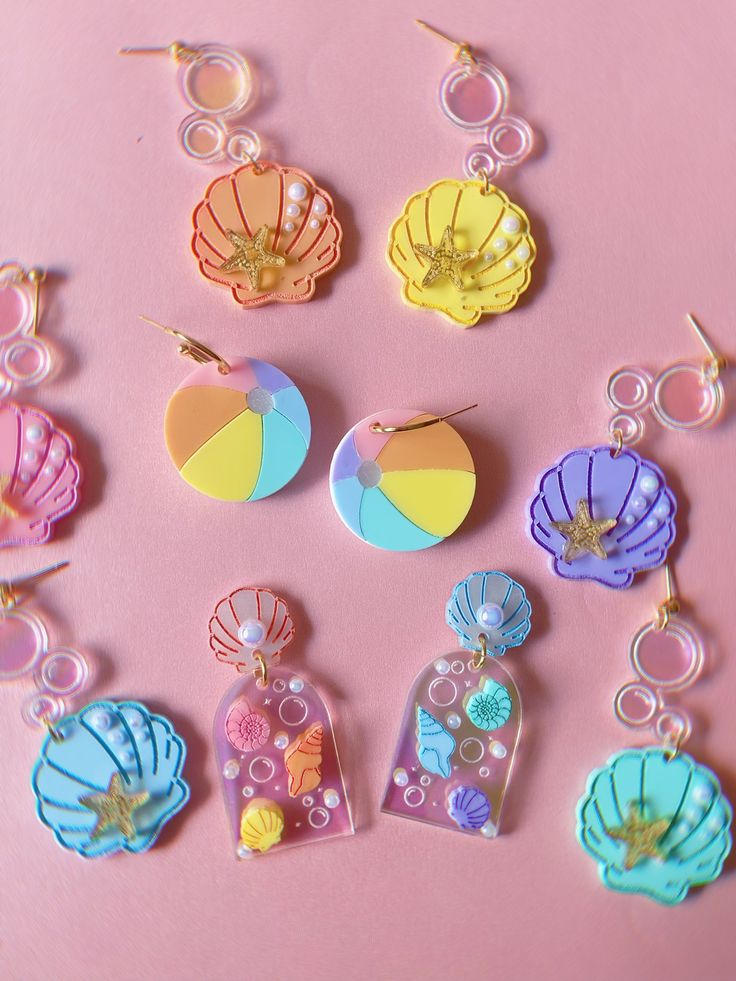 This listing is for ONE Pair of Pastel Shell Arch Earrings. Posts are hypoallergenic. If you wish to replace with lever backs or hooks please leave me a note at checkout. Earrings are approximately 2" Follow me on IG for shop updates! @shopcosmiclovelySubscribe to my newsletter for exclusive coupons! Fun Drop Earrings For Beach, Fun Dangle Earrings For Beach, Cute Adjustable Earrings For Beach, Cute Adjustable Earrings For The Beach, Resin Dangle Earrings For Beach, Playful Resin Dangle Earrings, Beach Fun Drop Earrings Jewelry, Cute Beach Drop Earrings, Themed Dangle Pierced Earrings