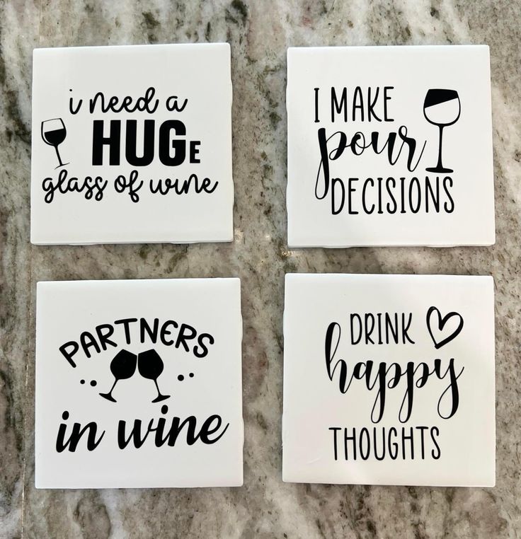 four coasters that say i need a hug glass of wine, partners in wine, drink happy thoughts