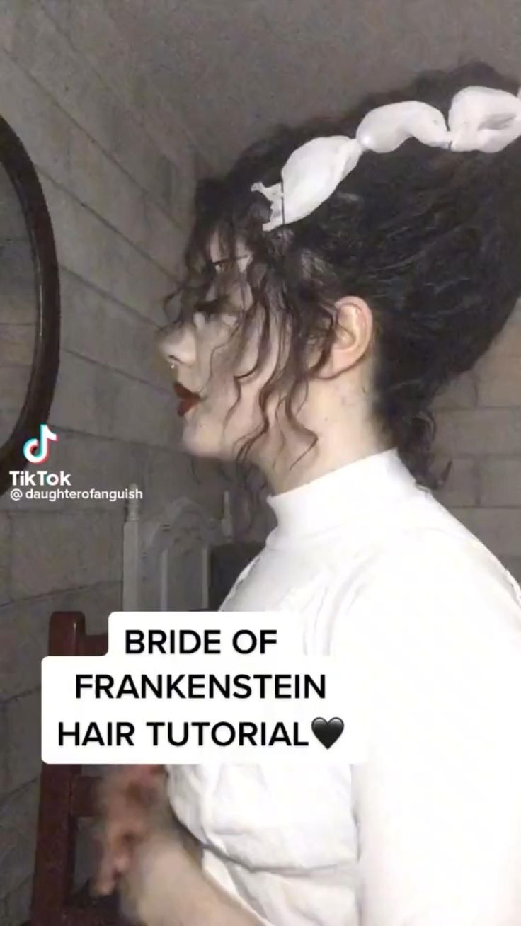 the bride of frankensten hair is wearing a white shirt and has her hair in a bun