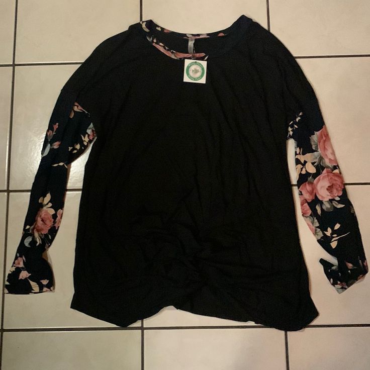 Nwt Beautiful Black Women’s Extra Large Long Sleeve Shirt With Floral Sleeves. The Middle Bottom Part Of The Shirt Is Gathered. It Is Soft And Flatters All Body Types. Black Floral Print Crew Neck Tops, Black Floral Cotton Top, Black Floral Print Stretch Tops, Black Stretch Top With Floral Print, Black Stretch Tops With Floral Print, Black Stretch Floral Print Tops, Black Long Sleeve Casual Top, Casual Black Long Sleeve Tops, Black Floral Print Tops For Fall