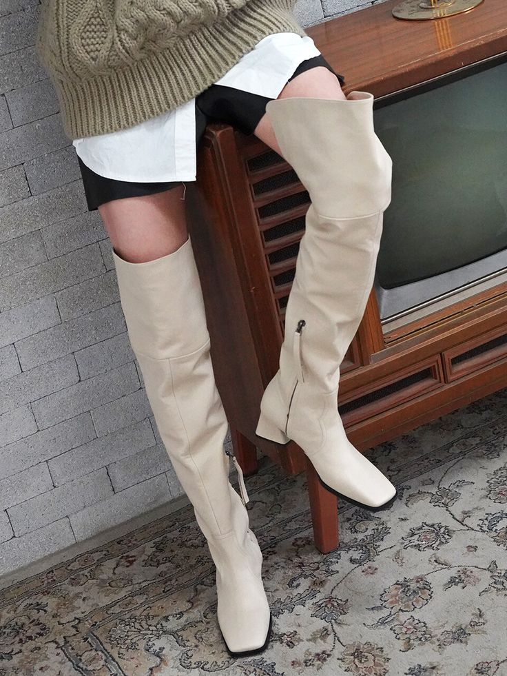 Editor's NotesRACHEL COX's shoes with the neat silhouette look great with every fall outfit- These thigh-high boots have an elegant, western boots silhouette- Incision line at the back of thigh for comfortable fit- Crafted from supple Italian cow leather that features a soft touch and natural texture- Glossy wrinkle with the vintage look- Half Zipper item, it's easy to pull on and off without hardware fasteningMeasurements(in.)- Size: KR225mm(US5.5) - KR250mm(US8) - Heel height 2. Beige Over-the-knee Boots For Fall, Fall Beige Over-the-knee Boots, Genuine Leather Knee High Boots, Black Velvet Shoes, Ripped Women, Heel Knee High Boots, Unique Boots, Sundress Casual, Leather Knee High Boots