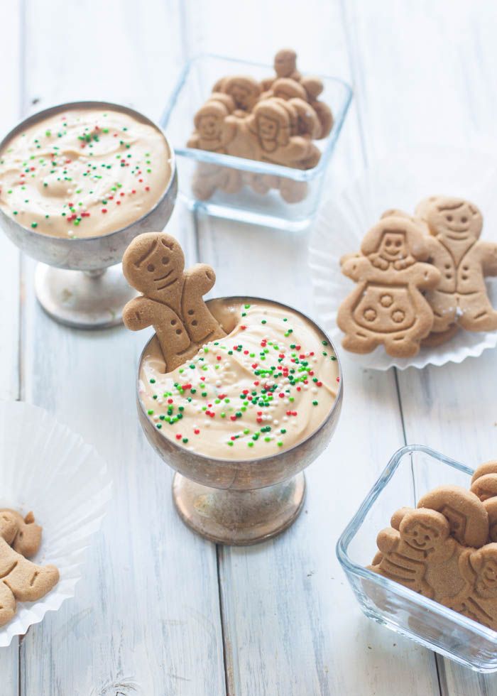 gingerbread desserts with frosting and sprinkles in small glass dishes