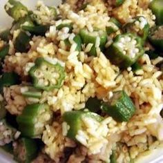 a white plate topped with rice and green peppers