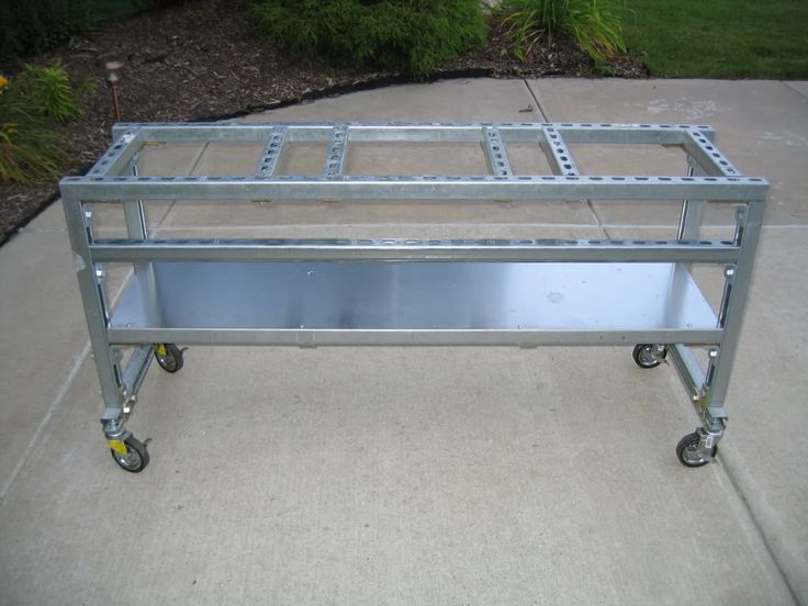 a metal cart sitting on top of a sidewalk