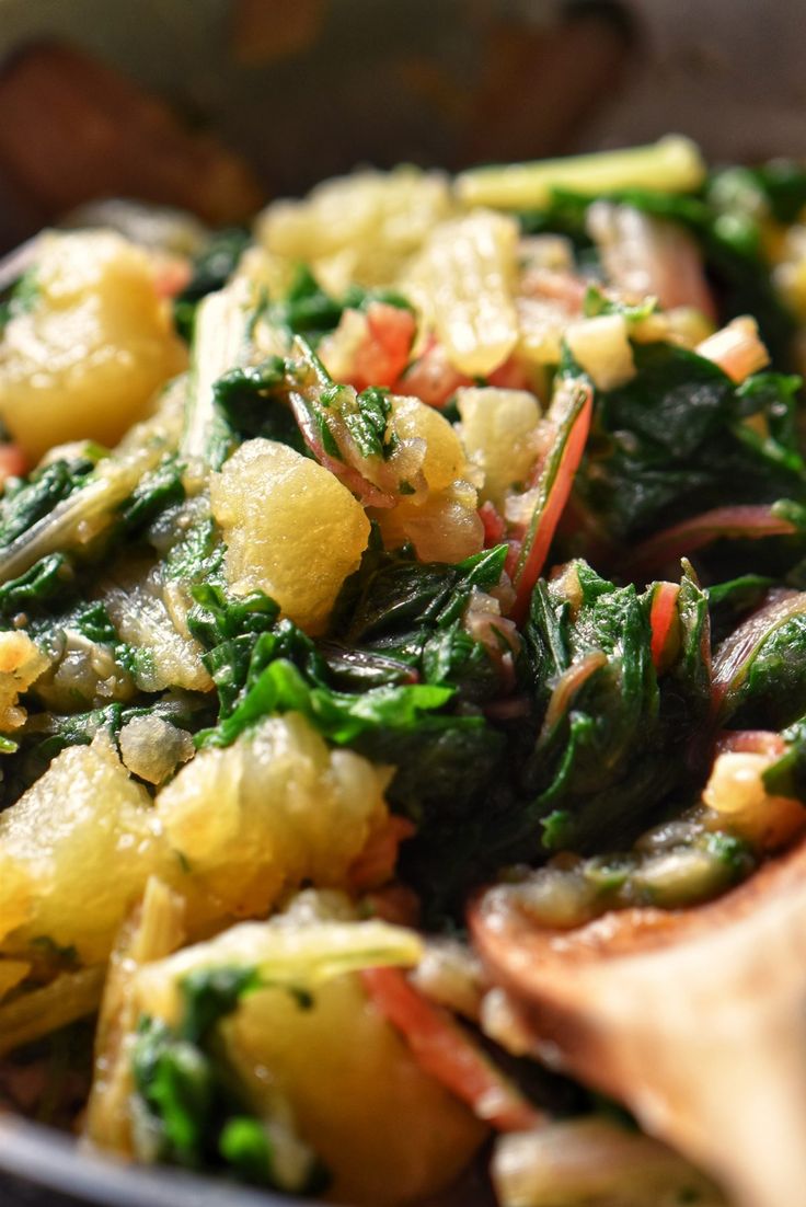 a close up of a plate of food with broccoli and other foods in it