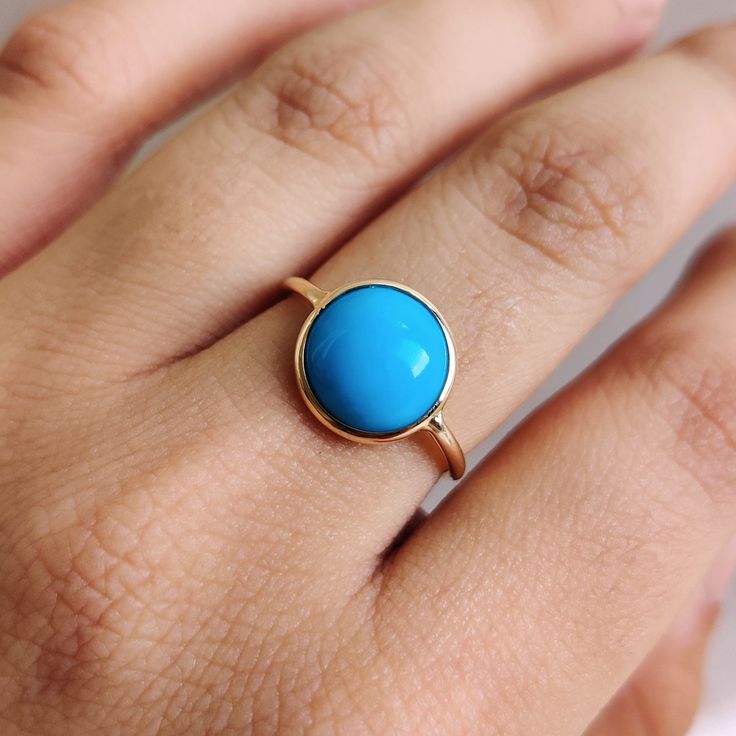 This stunning ring is set in 14k Solid Yellow Gold with Natural Arizona Turquoise with utmost precision. It is an unique dainty gemstone ring for nearly every occasion and is completely hassle-free jewelry. 🔷ABOUT GEMSTONE: Turquoise is a vibrant and highly valued gemstone that has been used for its beauty and perceived metaphysical properties. Turquoise is believed to provide protection against negative energies and harmful influences. It is thought to act as a shield, helping to ward off psyc Turquoise 14k Gold Jewelry With Bezel Setting, Yellow Gold Turquoise Birthstone Ring, Turquoise Round Bezel Set Jewelry, Handmade Turquoise Ring In Yellow Gold, Handmade Yellow Gold Turquoise Ring, Round Turquoise Gemstone Ring In 14k Gold, Turquoise Ring With Bezel Setting, 14k Gold Turquoise Gemstone Ring, 14k Gold Turquoise Round Ring