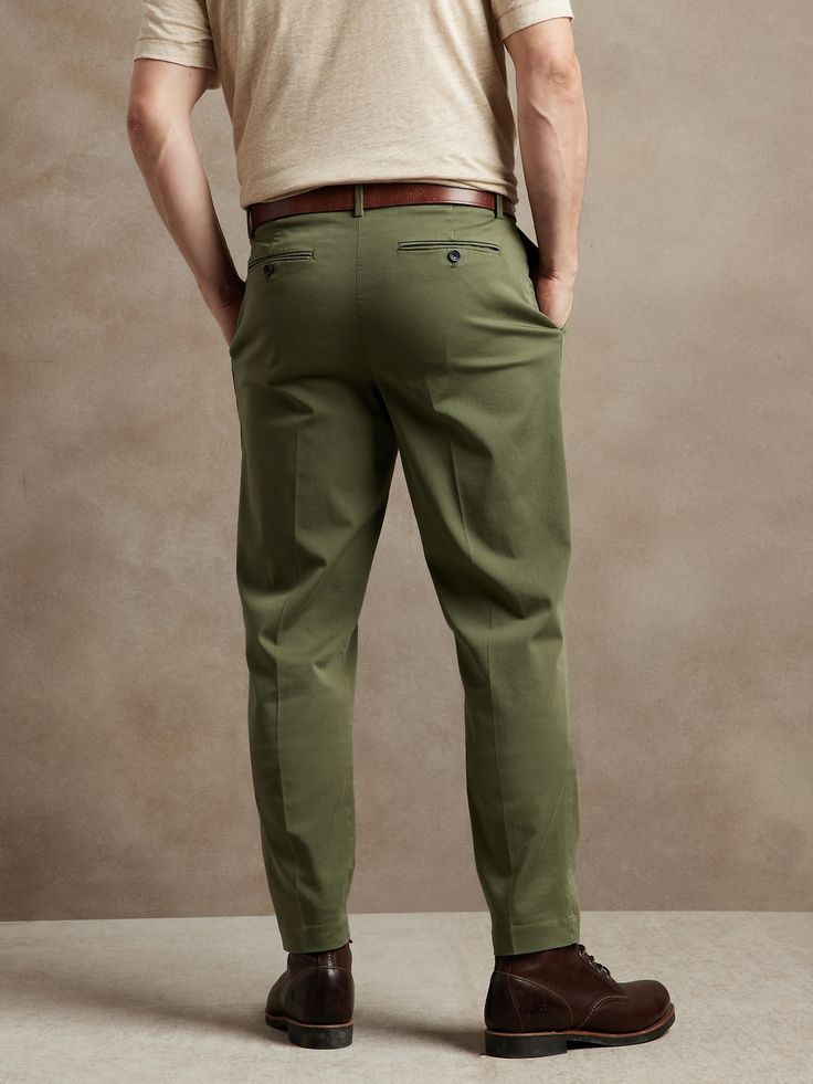 A sophisticated spin on our best-selling chinos, this tapered cotton pant has a pleated front and soft center crease at back so it's simple to fold and looks tailored when worn.  ATHLETIC TAPERED FIT: Not just for athletes, this fit is designed to de Dark Olive Green, Cotton Pants, Chinos Pants, Parachute Pants, Olive Green, Banana Republic, Khaki Pants, Pants, Trousers