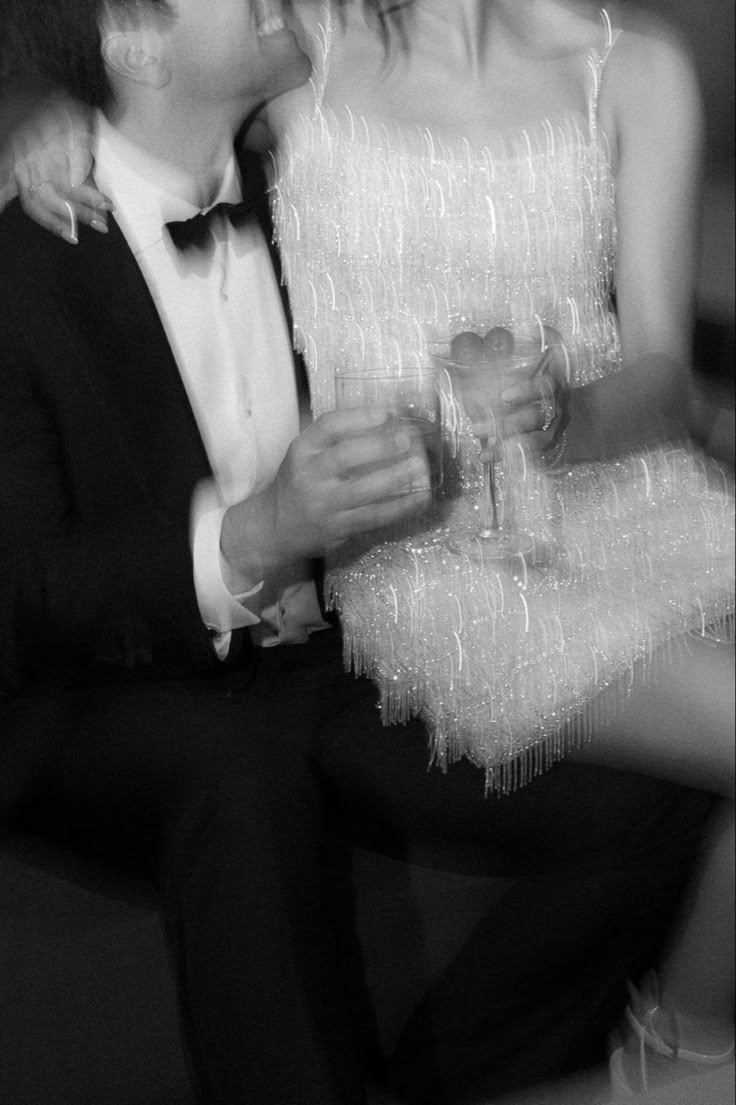 Wedding after party, sparkly mini dress, tuxedo, black and white wedding photgraphy, champagne, blurry wedding photo Wedding Tuxedo Aesthetic, Black And White Flash Wedding Photos, Wedding After Party Club, New Year’s Eve Engagement Photos, Wedding Blurry Photos, Couple Nye Photo, Black And White Flash Photography, Late Night Wedding Photos, Wedding After Party Photos