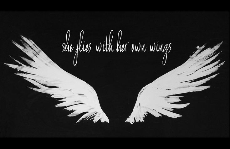 white wings with the words she flies with her wings written in black on a dark background