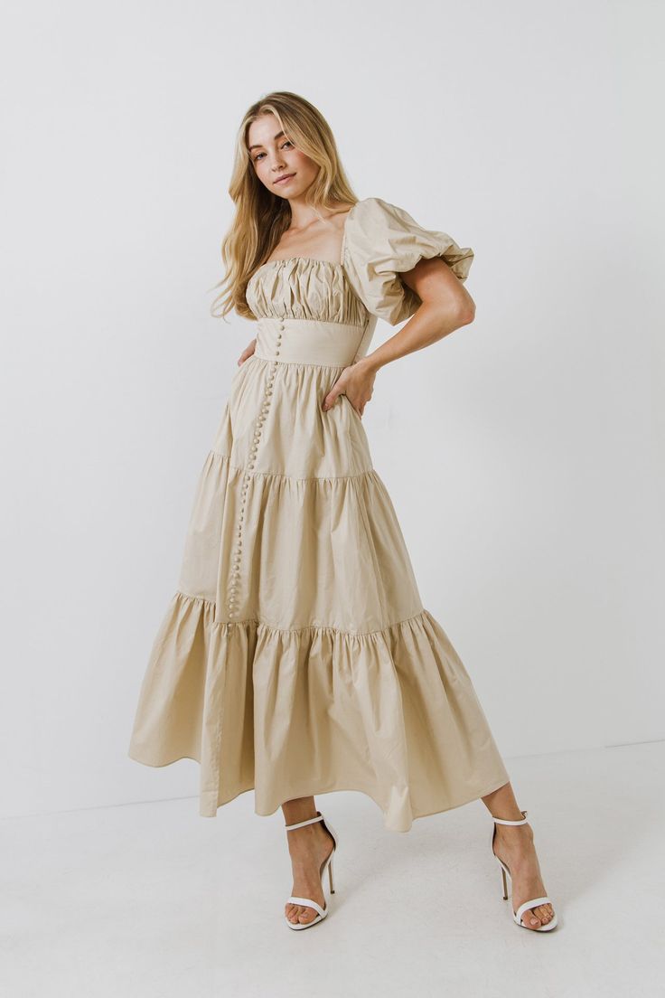 This beige hue maxi dress with puff sleeves is perfect for a formal event or special occasion! The corset-style bodice and front slit add a touch of glamour, while the comfortable fabric makes it easy to wear. Ruched bust Puff sleeve Fake cover buttons Front slit Maxi length Partial back smocking Side zipper Partial lining Shell: 100% Cotton Lining: 80% Polyester 20% Cotton Style# HN636D Size on Model: XS Measurements from size XS: Total length: 53", Bust: 32" Summer Long Dresses, Corset Maxi Dress, Cotton Maxi Dress, Cotton Maxi, Maxi Dress Cotton, Corset Style, Nordstrom Dresses, Cotton Style, Chiffon Tops