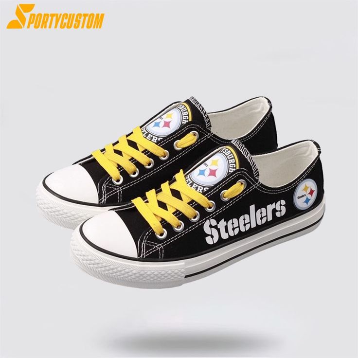 a pair of black and yellow shoes with pittsburgh football logos on them