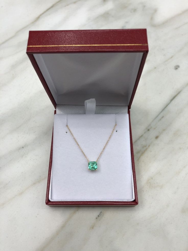 Featured here is a 1.32-carat stunning, Colombian emerald necklace in fine 14K yellow gold. Displayed in the center is a medium-light green emerald with incredible crystal clarity, accented by a simple four-prong gold mount, allowing for the emerald to be shown in full view. The earth mined, green Colombian emerald has a desirable lush green color with excellent qualities. An 18 inch is attached to the emerald pendant. This necklace is ideal for everyday use and is the perfect accessory to any o Formal Hallmarked Emerald Necklace, Formal Emerald Necklaces With Diamond Cut, Formal Gold Sterling Silver Emerald Necklace, Emerald Necklace In Brilliant Cut, 14k Gold Emerald Cut Solitaire Necklace, Emerald Cut Solitaire Necklace In 14k Gold, Formal Emerald Necklace With Diamond Cut, Exquisite Green Necklace With Brilliant Cut, Green Brilliant Cut Necklace For May Birthstone