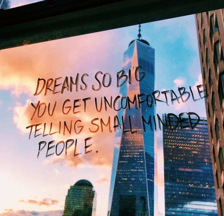 a window with writing on it and the words dream so big you get uncomfortableable telling small minded people