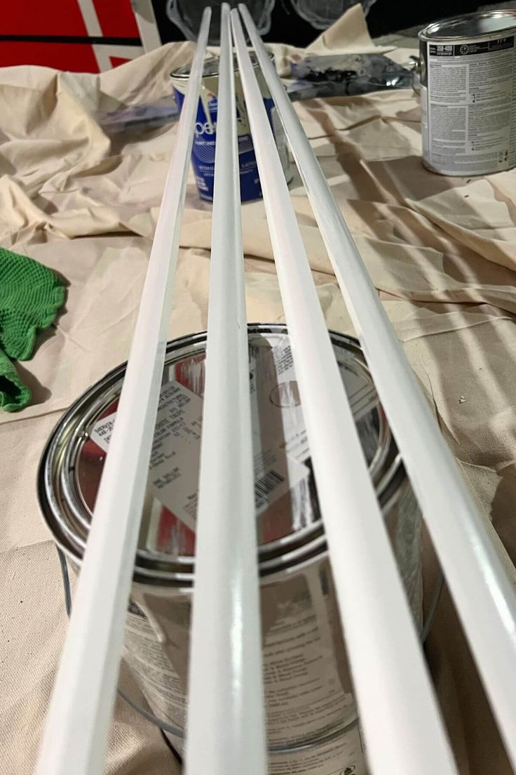 the paint is being applied to the metal tubes