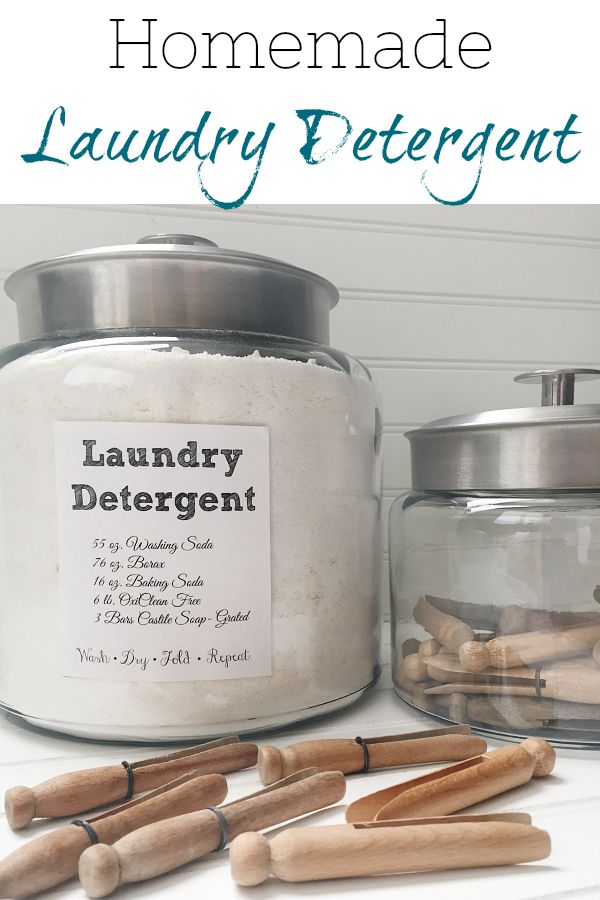 an old fashioned laundry detergent is sitting next to some wooden sticks and a glass jar