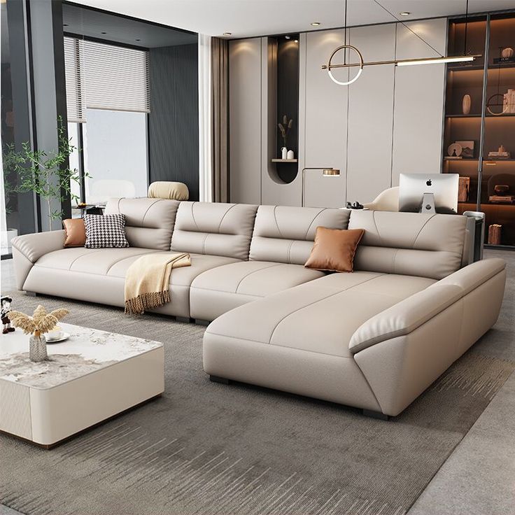 a modern living room with large sectional sofa