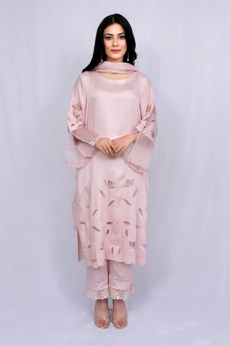 Pastel pink kurta with floral cutwork and sheer sleeve hem detailing. Paired with tonal pant and kota dupatta.
Component: 3
Type Of Work: Floral
Neckline: Round
Sleeve Type: Full sleeves
Fabric: Modal Satin, Kota, Organza
Color: Pink
Other Details: 
Sheer sleeve hem
Nalki work or neckline
Scallop hem on kurta
Occasion: Puja - Aza Fashions Pink Long Sleeve Salwar Kameez With Lace Work, Unstitched Salwar Kameez With Lace Work For Spring, Pink Georgette Kurta With Self Design, Pink Self Design Georgette Kurta, Pink Self-design Georgette Kurta, Pink Long Sleeve Kurta With Cutwork, Elegant Pink Lace Work Sets, Feminine Fitted Sets With Resham Embroidery, Pink Unstitched Salwar Kameez With Lace Work